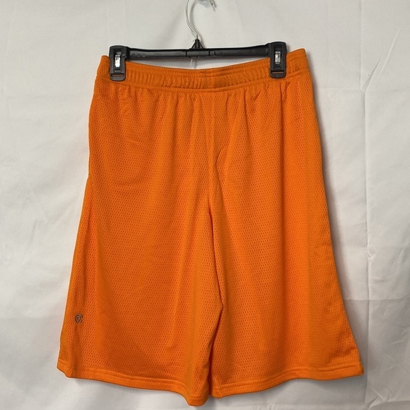 Kids orange basketball shorts, size XL. 2 pockets and drawstring. - Picture 2 of 5